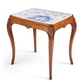 41. A rococo faience-top tea table, Rörstrand 1765.