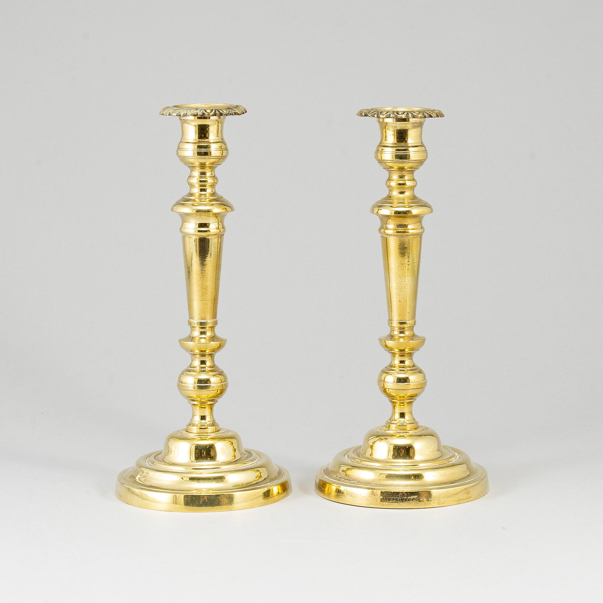 A pair of bronze candlesticks, first half of the 19th century.