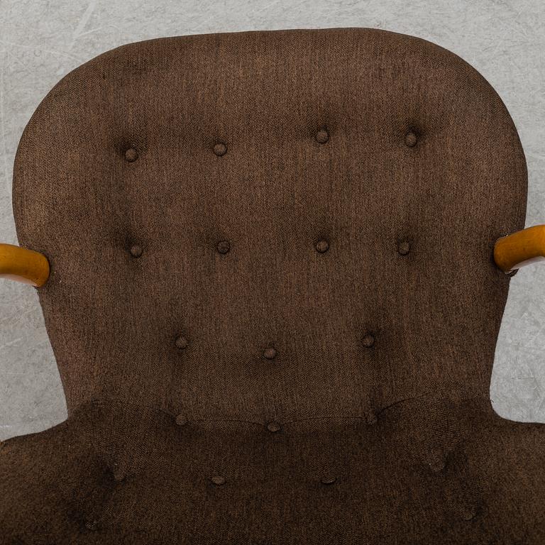 A mid 20th century rocking chair, Muslingestolen, attributed to Philip Arctander.