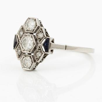 A platinum ring set with round brilliant-cut diamonds and sapphires, Art Déco.