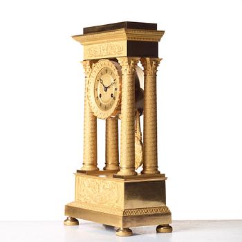 A Empire early 19th century gilt bronze mantel clock.