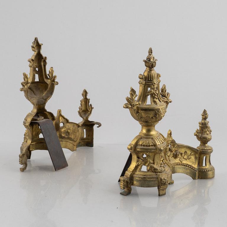 A pair of Louis XVI-style bronze andirons, France, later part of the 19th century.