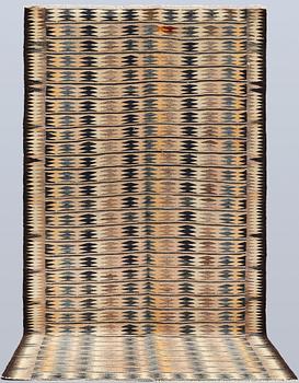 A Persian Nomad Kilim carpet, ca 286 x 155 cm.