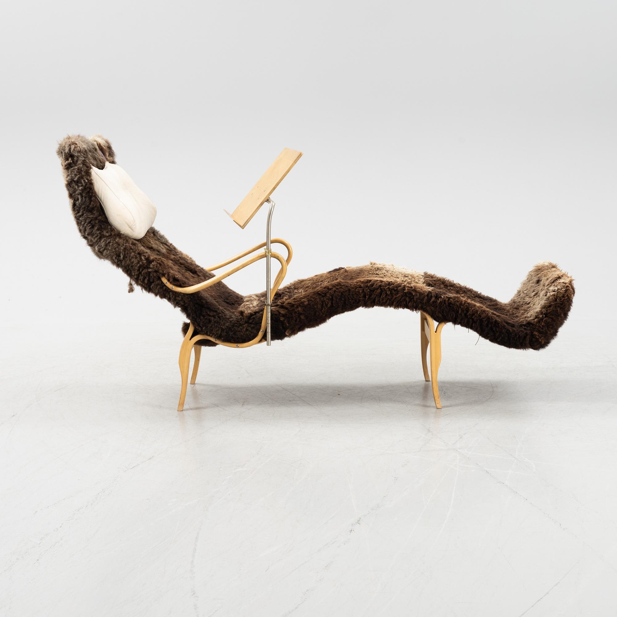 A 'Pernilla 3' lounge chair by Bruno Mathsson for Firm Karl Mathsson dated 1964.