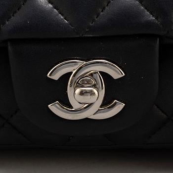 CHANEL, a black leather 'Extra mini flap bag' 2012-13.