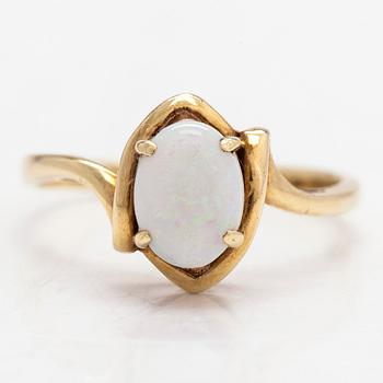A 14K gold ring with an opal.