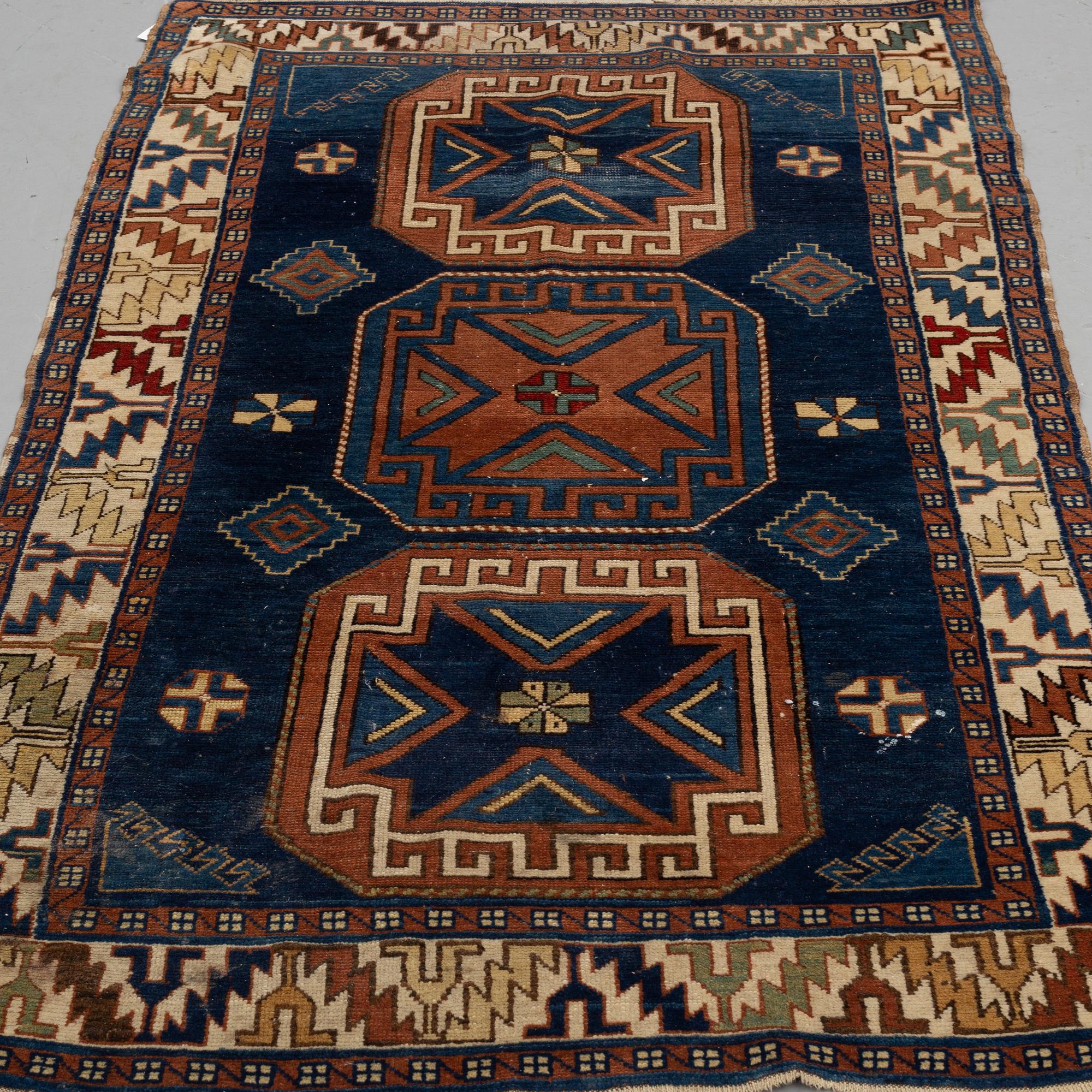 A RUG, a semi-antique Caucasian, ca 175 x 102 cm.