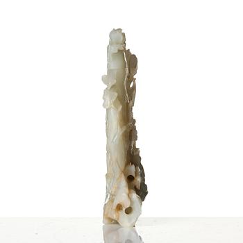 A well sculptured pale green and russet coloured nephrite vase with cover, 20th century.