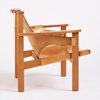 Carl-Axel Acking, a Swedish Modern oak and natural brown leather 'Trienna' chair, Nordiska Kompaniet.