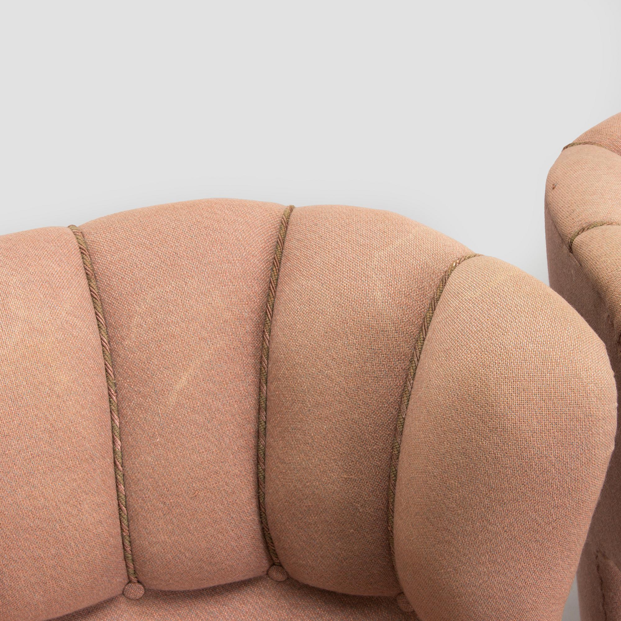 A pair of mid-20th century armchairs.