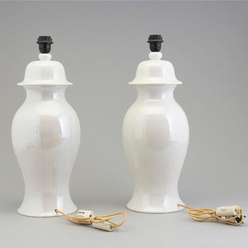 A pair of white ceramic table lamps bu Tommaso Barbi, Italy, 1970.