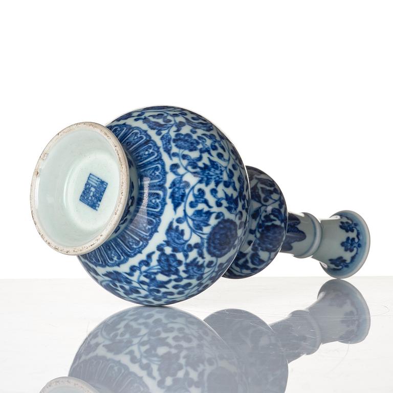 A blue and white gourd shaped lotus vase, presumably Chinese Republic with Qianlong mark.