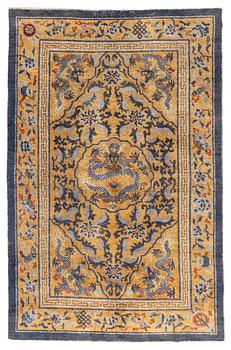 1207. An antique Imperial silk 'Five dragon' palace rug, Qing dynasty, 1880. Measure approx. 238 x 154.5 cm.