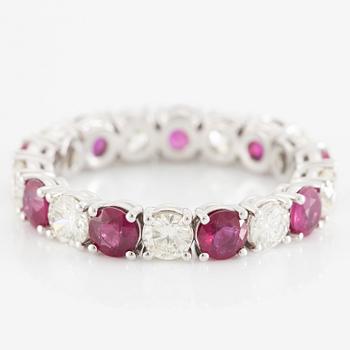 Ring, full eternity band, 18K white gold set with rubies and brilliant-cut diamonds.