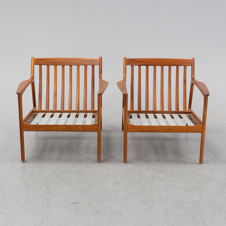 A pair of USA 75, teak lounge chairs by Folke Ohlsson for Dux.