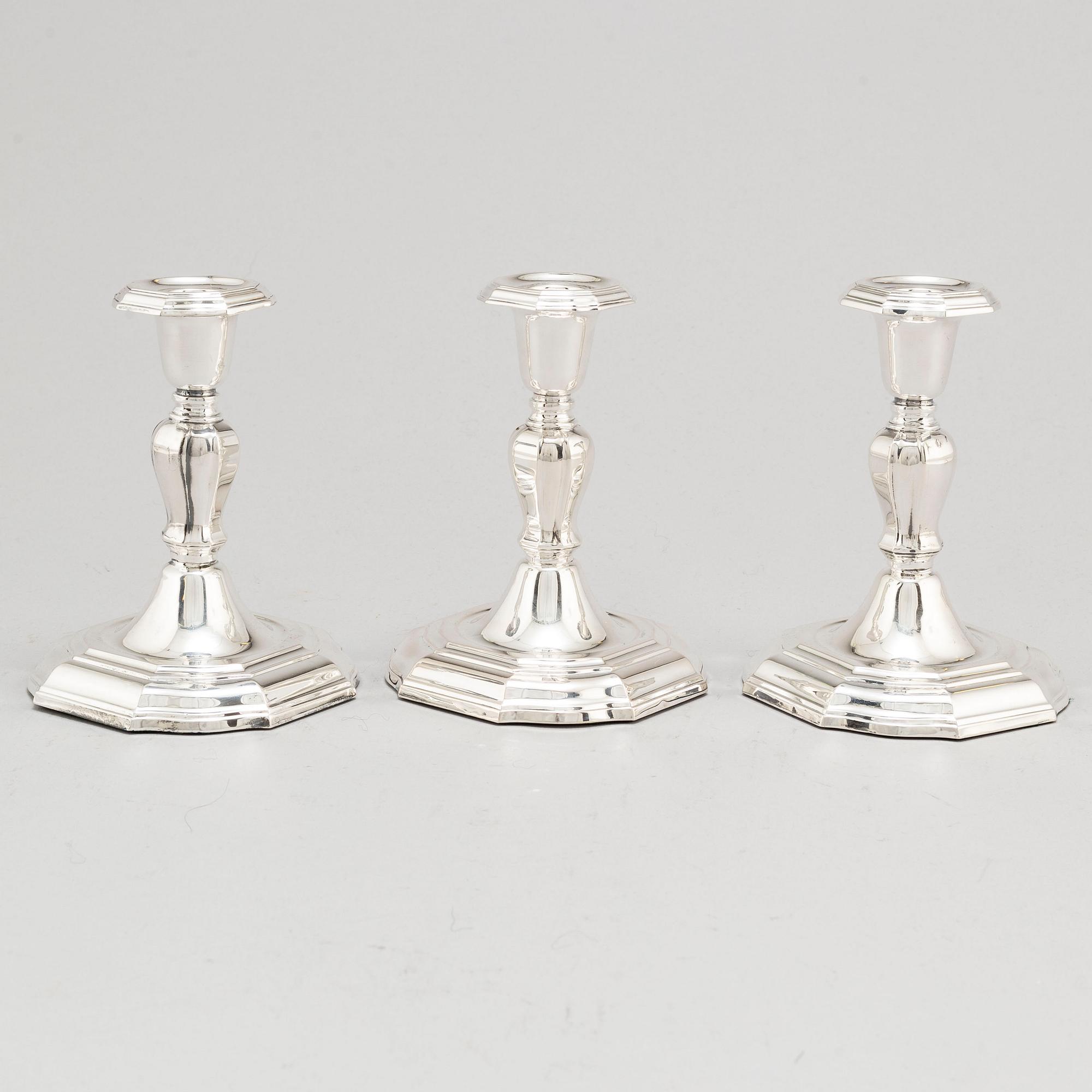 A set of three Swedish silver candlesticks, maker's mark CG Hallberg, Stockholm 1955-1957.