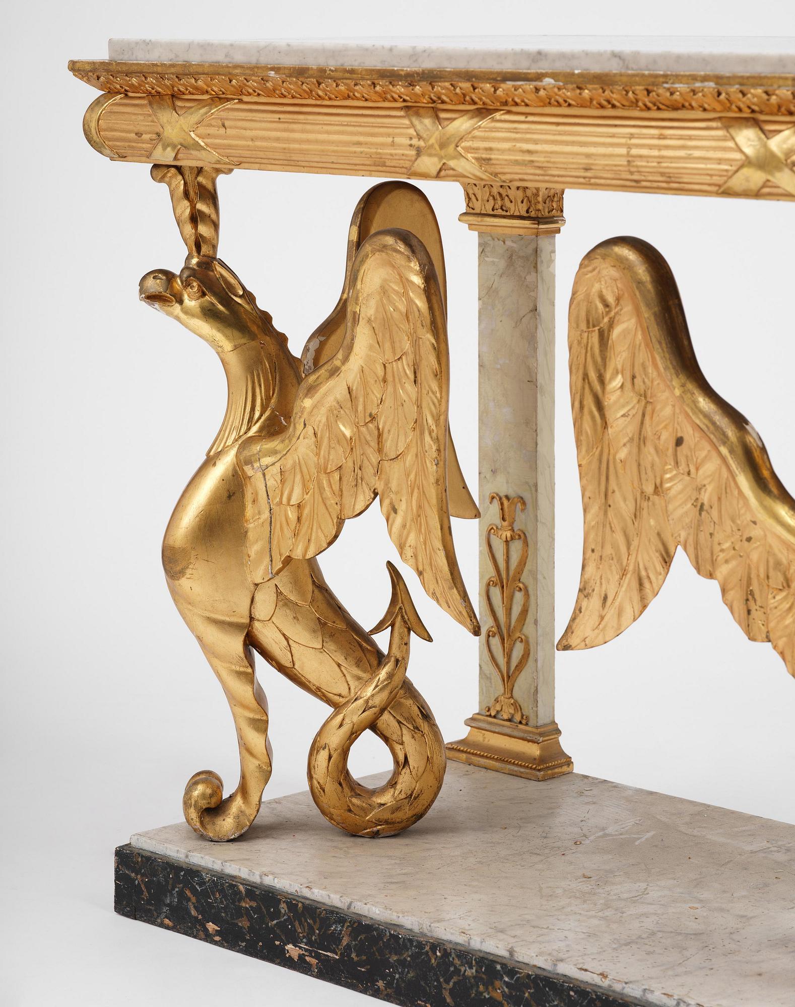 A Swedish Empire gilt wood and white marbel console table.