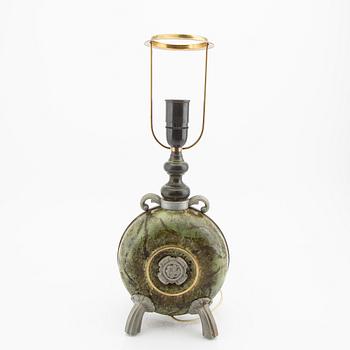A 1940s metal table lamp.