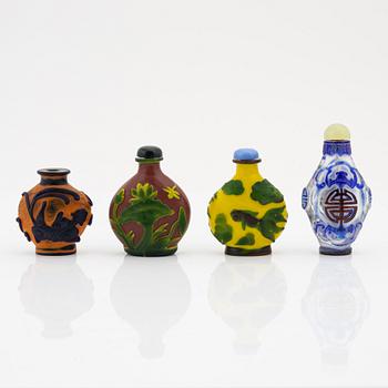 A group of four Beijing glass snuff bottles with stoppers, China, modern.