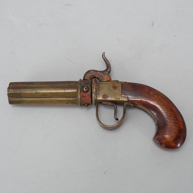 A PERCUSSION PISTOL, four barrels, 19TH CENTURY.