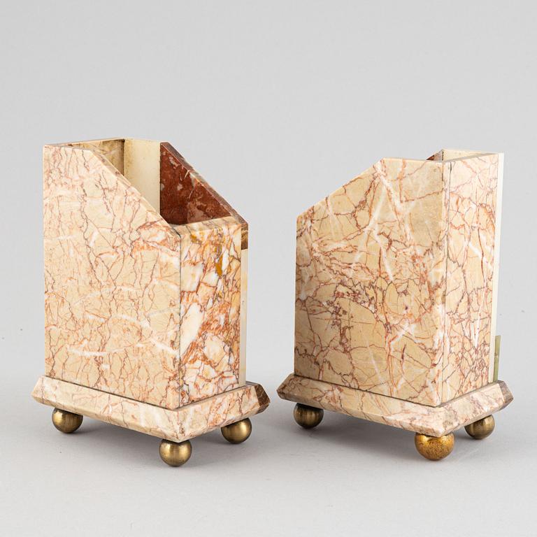 An Art Déco marble mantle clock and a pair of book ends, 1920's.