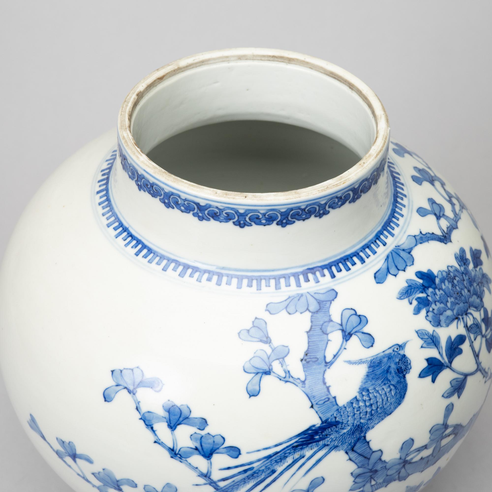 A Chinese blue and white Kangxi-style jar with lid, 20th century.