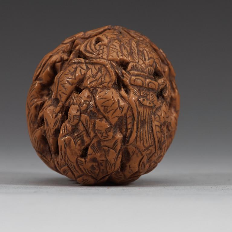 A set of six carved walnut hand exercisers, late Qing dynasty (1644-1912).