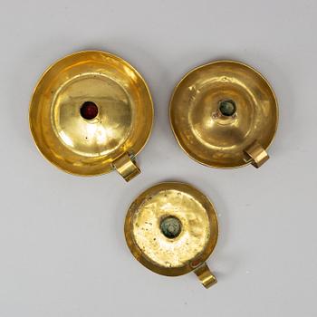 Three 19th century brass night light holders.