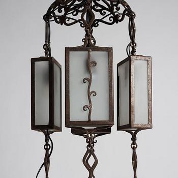 Carl Westman, attributed to, a wrought iron and frosted glass Art Nouveau chandelier, Sweden ca 1915.