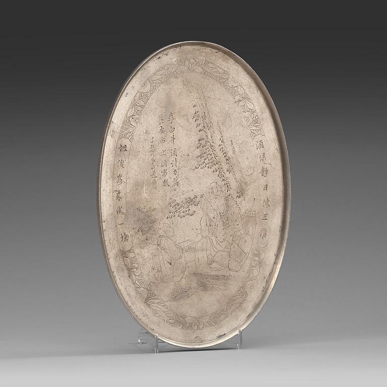 A pewter tray with incised portrait of the Tang poet Li Bai (701-762), late Qing dynasty (1644-1912).