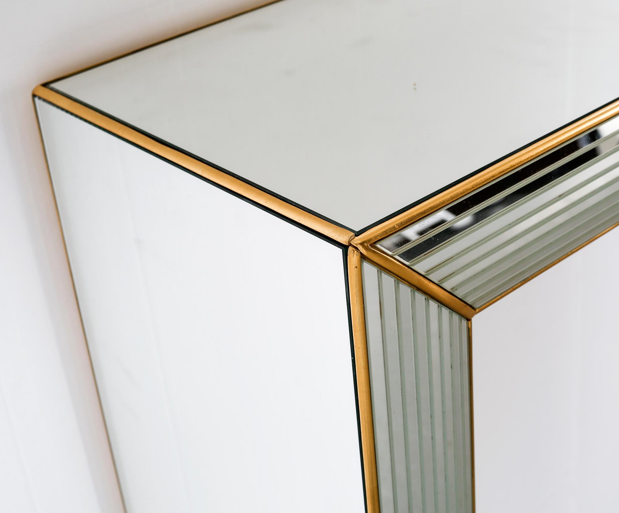 A late 20th century mirror and console table by Deknudt, Belgium.