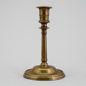 A 1500s bronze candlestick.