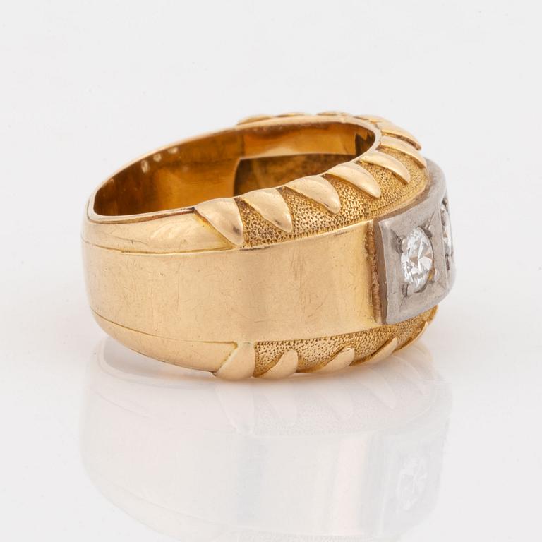 Gold and brilliant cut diamond three stone ring.