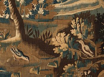 A TAPESTRY, tapestry weave, "a Verdure", ca 268-277 x 264,5-266 cm, Flanders around 1700.