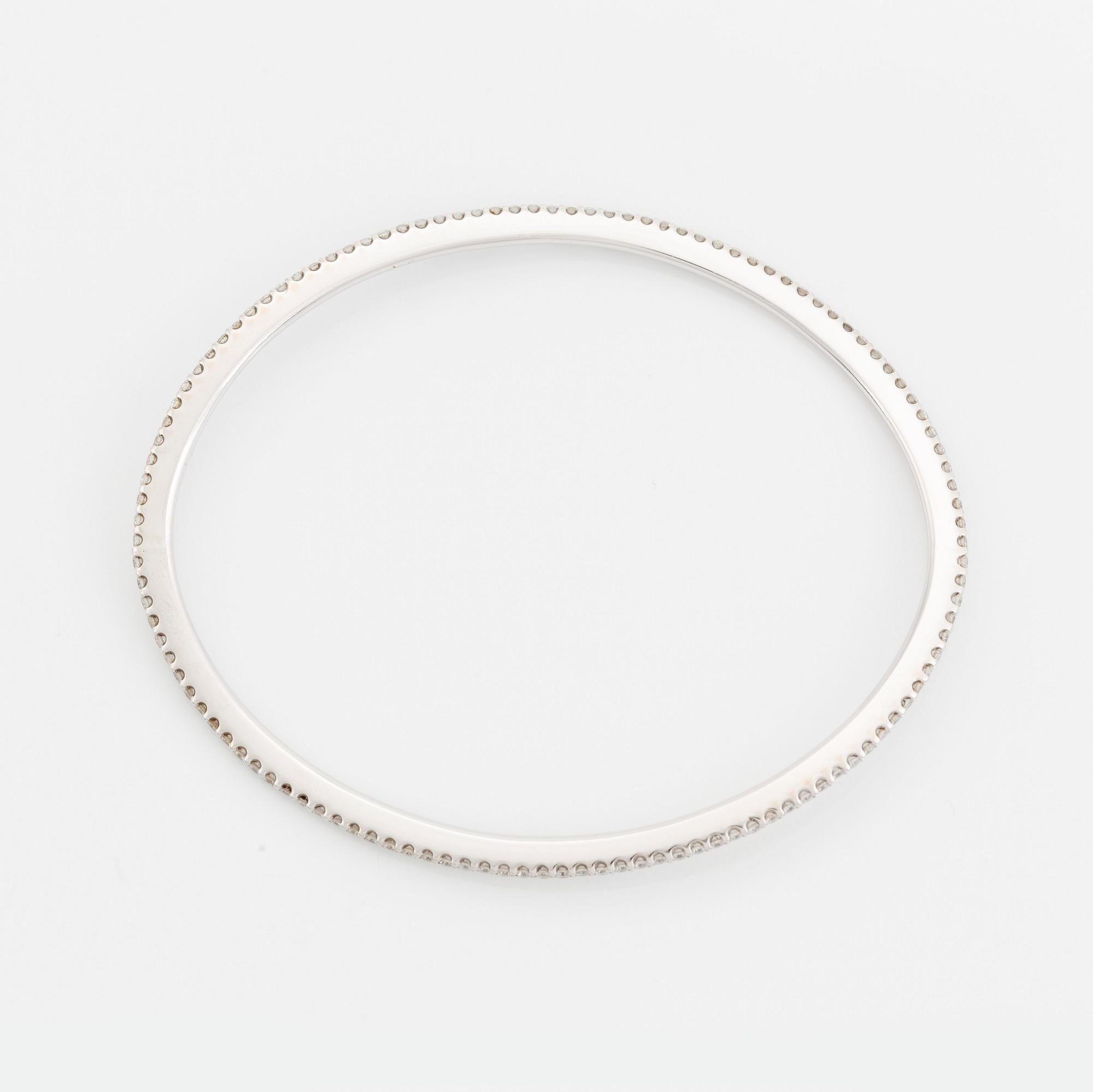 An Ole Lynggaard 18K white gold "Love" bangle set with round brilliant-cut diamonds, design Charlotte Lynggaard.