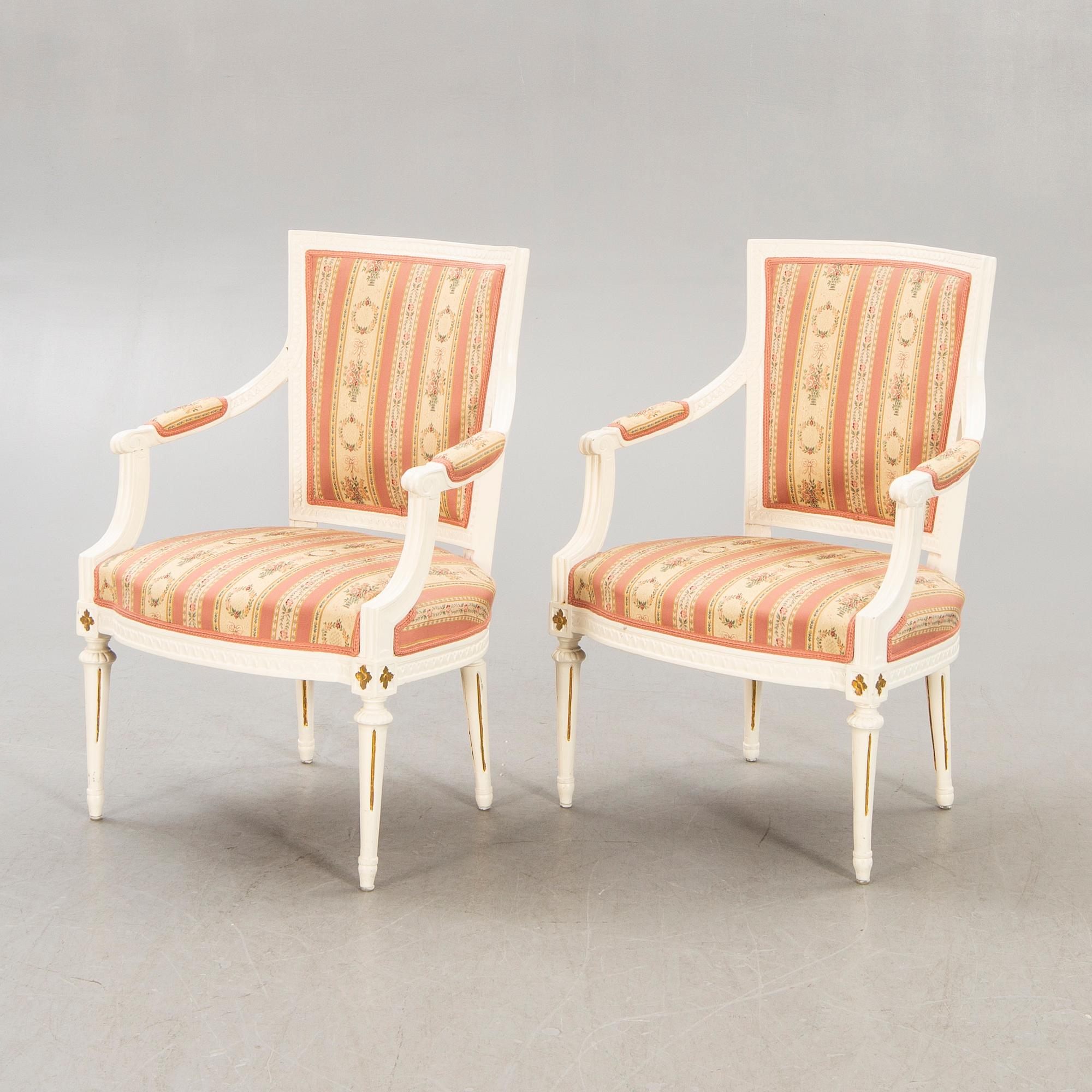 A pair of Swedish painted late Gustavian armchairs around 1800.
