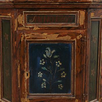 A 18th century corner cabinet.