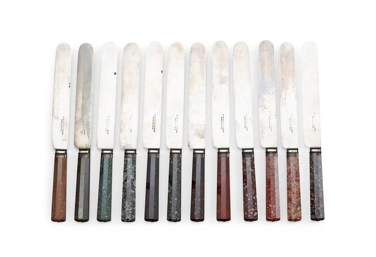 Twelve Swedish 19th centry porphyry knife handles.