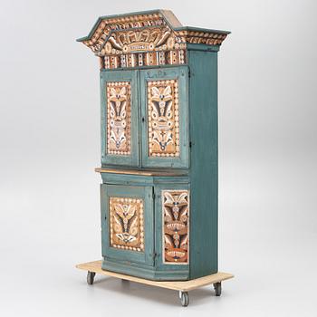 A Dalecarlian polychrome painted cabinet, dated 1798.