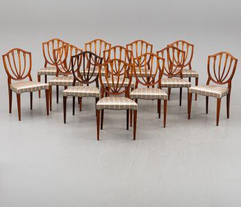 A dining table and 12 chairs, second half of the 20th century.