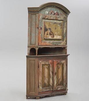 A Swedish polychrome-painted corner cabinet attributed to J. Bäckström (1773-1837).