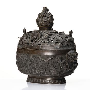 A bronze reticulated incense burner with cover, Qing dynasty (1644-1912).