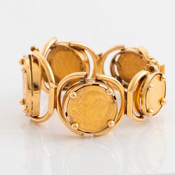 An 18K gold bracelet set with Mexican 22K gold coins.
