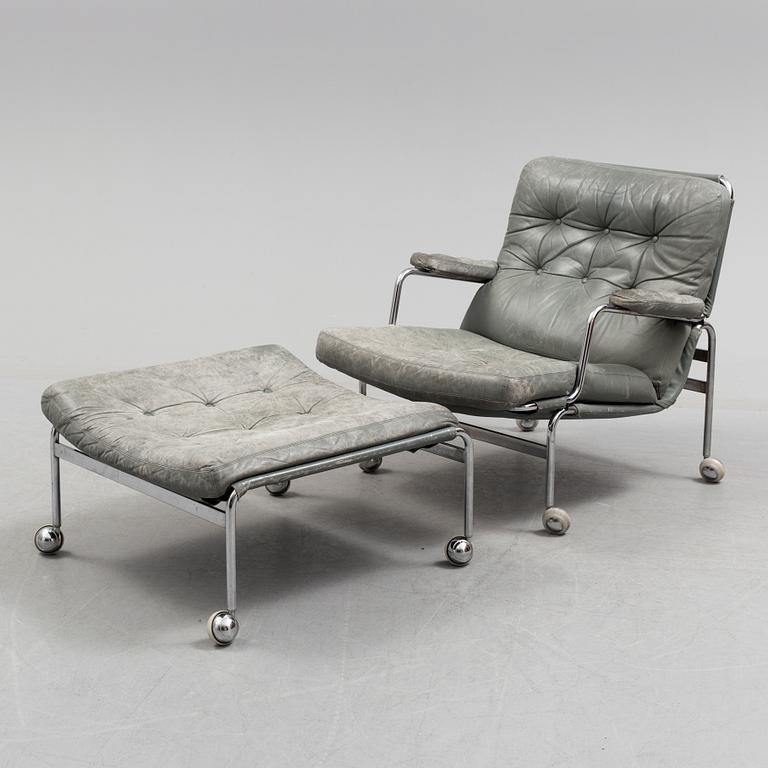 A second half of the 20th century easy chair and footstool.