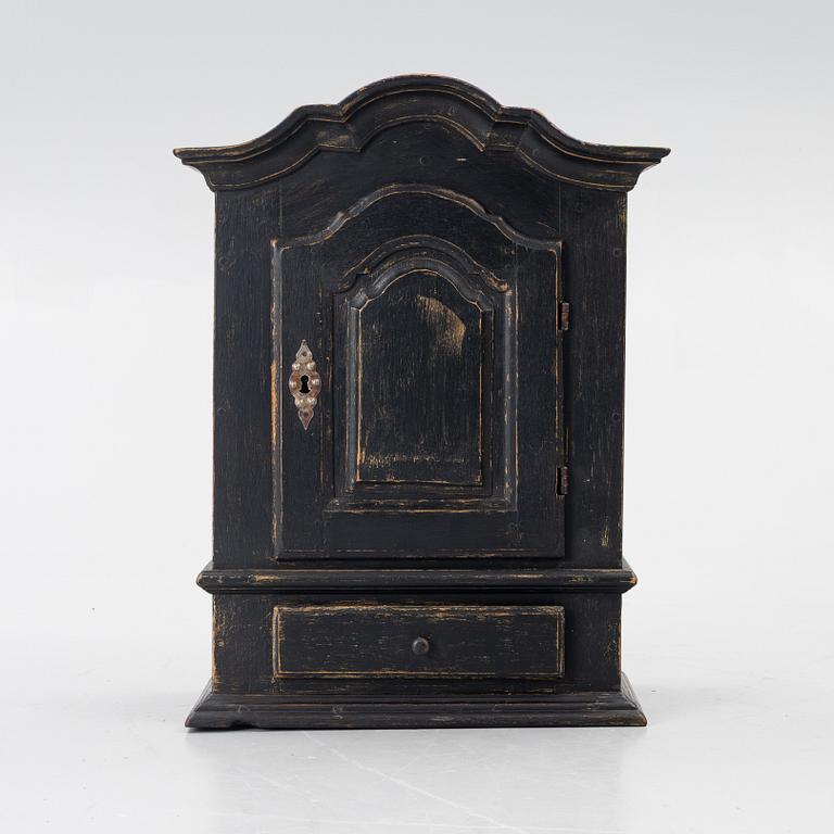 A Baroque wall cabinet, 18th Century.