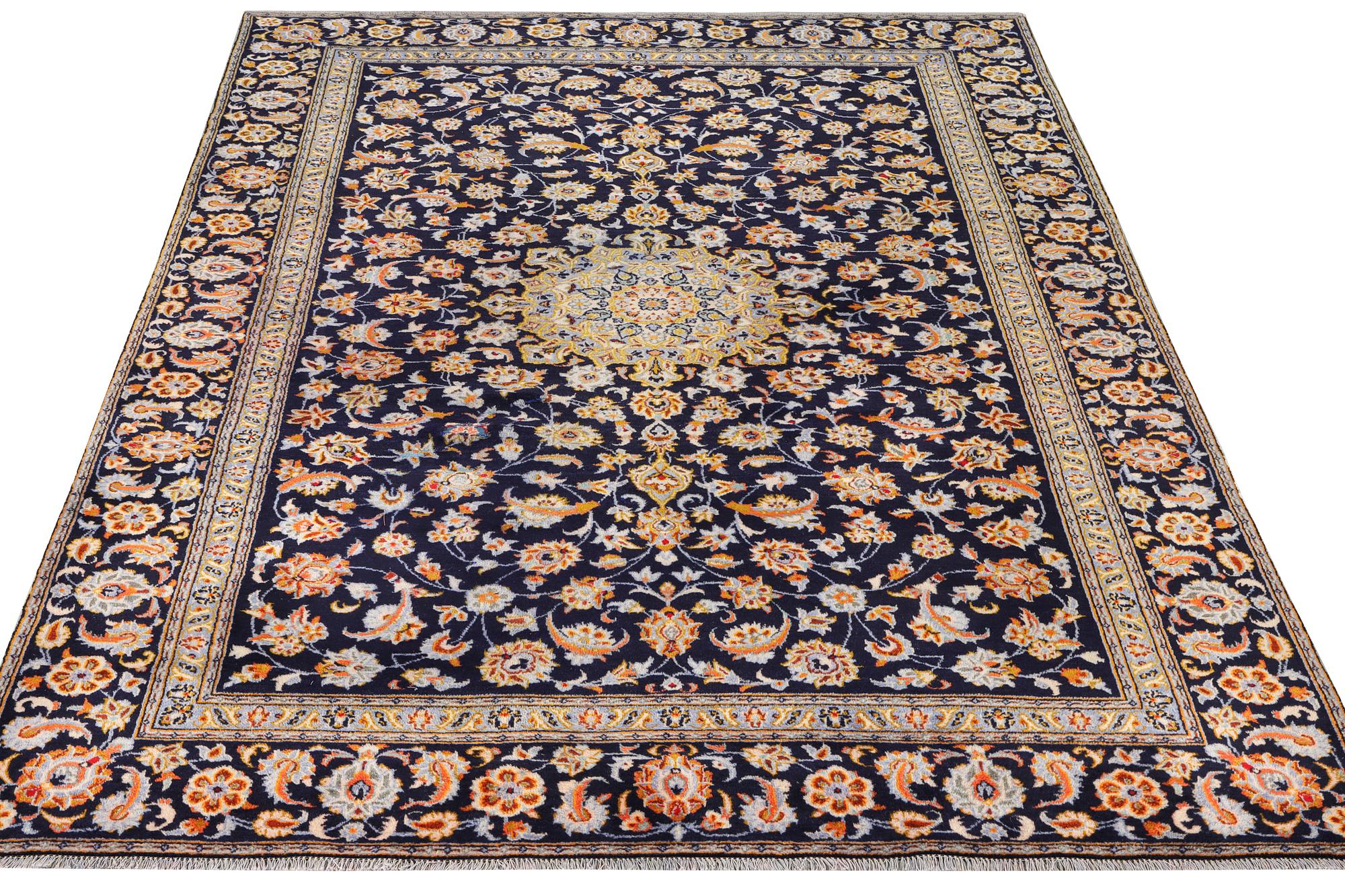 A Kashan carpet, c. 335 x 224 cm.