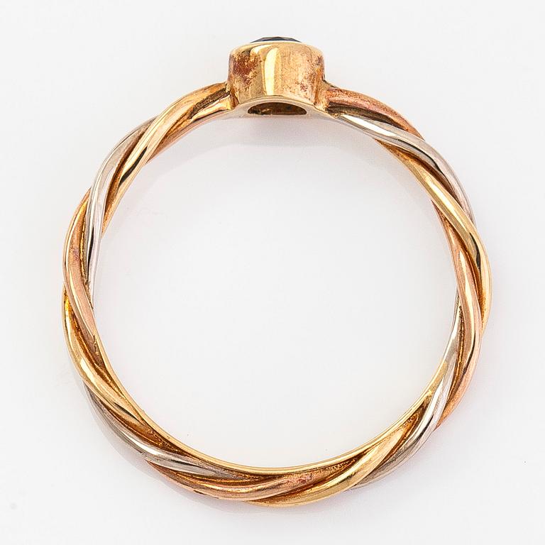 Cartier, an 18K tri-colour gold ring with a sapphire.