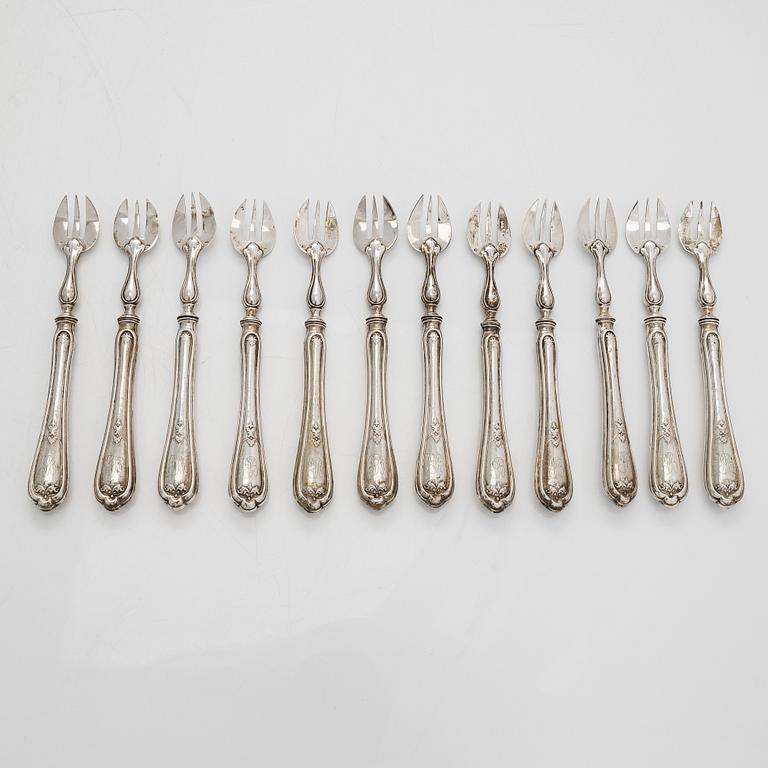 A set of twelve Belgian silver oyster forks.