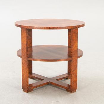 A mid 1900s walnut Art Deco table.
