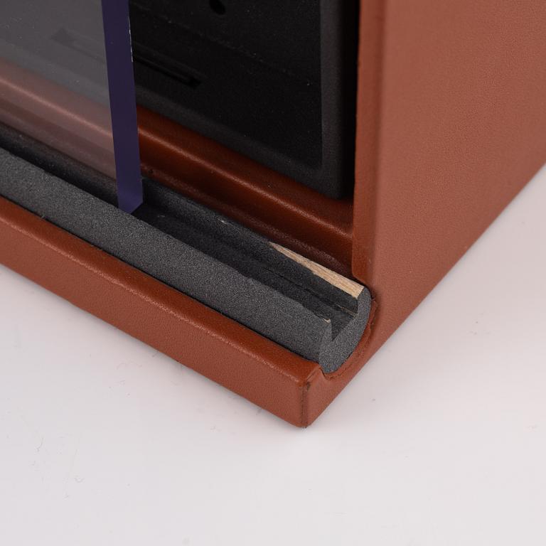 Two watch winders, Underwood, London.